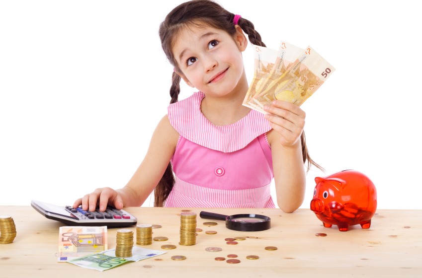 Girl at the table counts money
